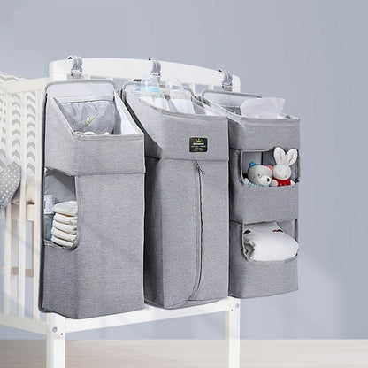 Maroon Chronos baby diaper caddy with dividers for organizing diaper supplies and essentials in a nursery or changing area.