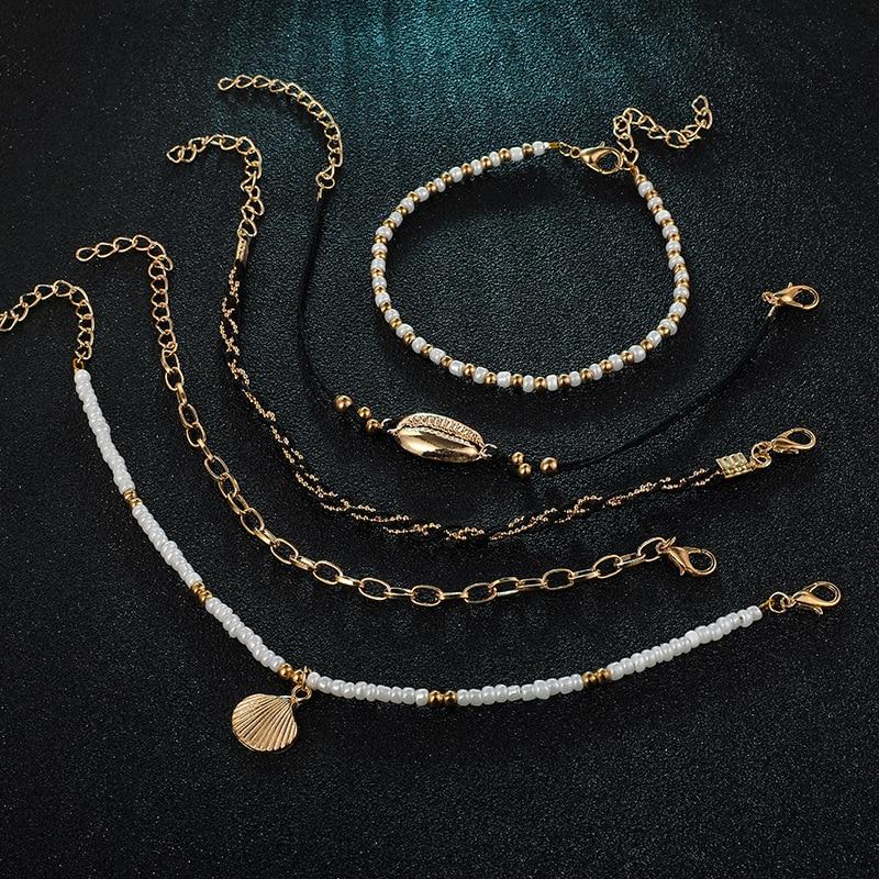Multi-layered gold shell pendant chains ankle bracelet with delicate designs, by Coffee Jasper, perfect for stylish summer accessories.