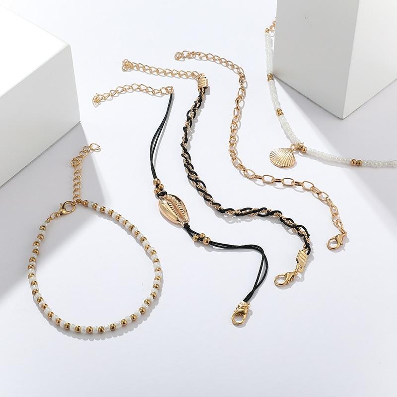 Multi-layered gold shell pendant chains ankle bracelet by Coffee Jasper featuring layered design and delicate chain details.