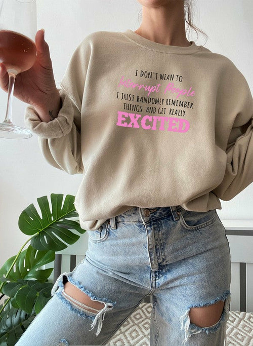 Black "I Don’t Mean To Interrupt People EXCITED" T-shirt by Jade Thalassa, casual shirt with bold printed text on front.