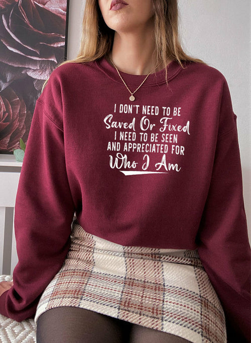 Jade Thalassa I Don’t Need To Be Saved Or Fixed T-shirt featuring bold text on a casual cotton shirt.