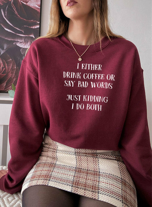 Jade Thalassa T-shirt with humorous coffee and bad words slogan, featuring casual fit and soft fabric, on a plain background.