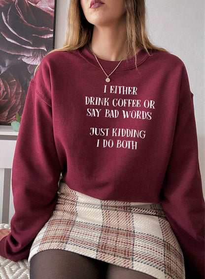 Jade Thalassa T-shirt with humorous coffee and bad words slogan, featuring casual fit and soft fabric, on a plain background.
