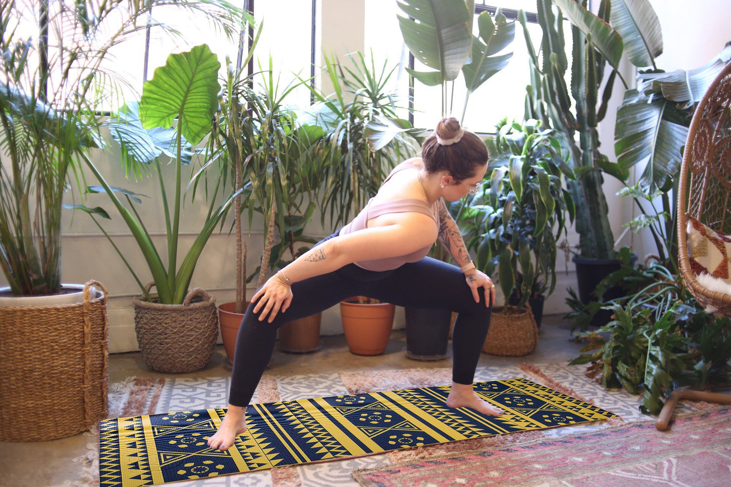 Azure Jason printed PVC premium yoga mat laid out on a wooden floor, showcasing its colorful, textured surface for yoga practice.