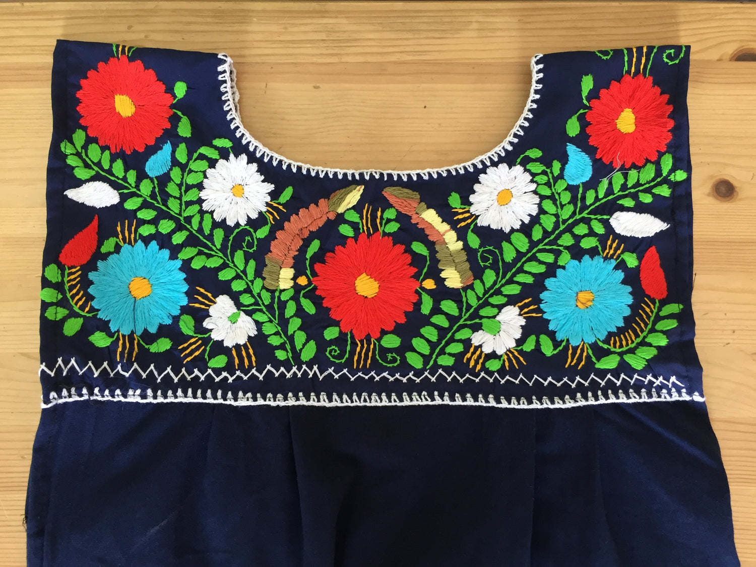 Hand embroidered Mexican loose dress named Elvira by Violet Athena, featuring vibrant embroidery and flowing fabric for women&