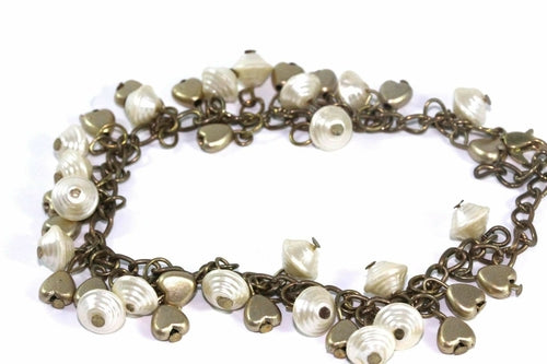 Silver Hestia Golden Hearts and Shells Charm Bracelet featuring gold heart and shell charms on a silver chain.