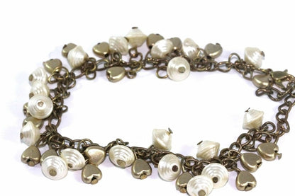 Silver Hestia Golden Hearts and Shells Charm Bracelet featuring gold heart and shell charms on a silver chain.