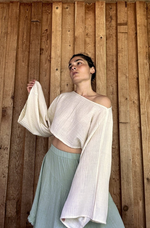 Salmon Arrowwood Bloomara top for women, featuring a stylish, fitted design with a V-neck and short sleeves, displayed on a mannequin.