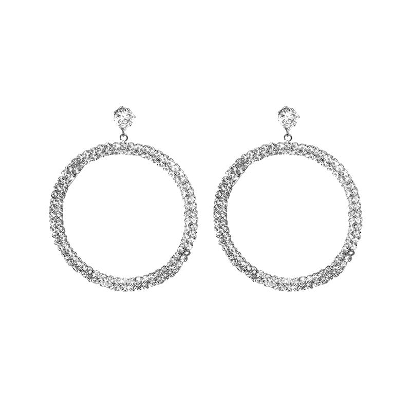 Elegant diamond hoop earrings by Blush Bella featuring sparkling round-cut diamonds and a polished gold finish.
