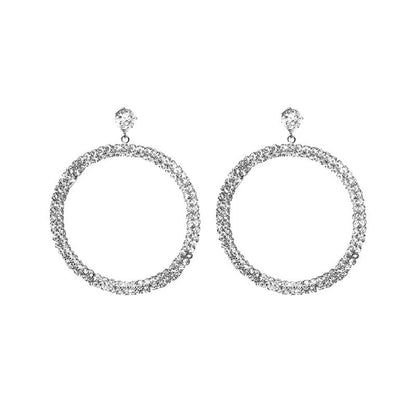 Elegant diamond hoop earrings by Blush Bella featuring sparkling round-cut diamonds and a polished gold finish.