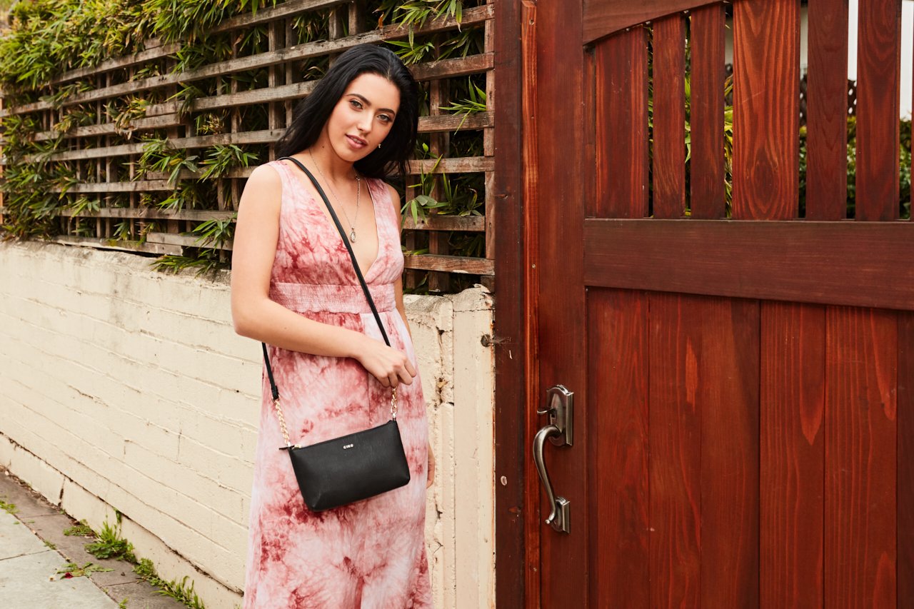 Pink Lucy Two Chain Crossbody bag with silver chains and adjustable strap, featuring a stylish, compact accessory for everyday use.