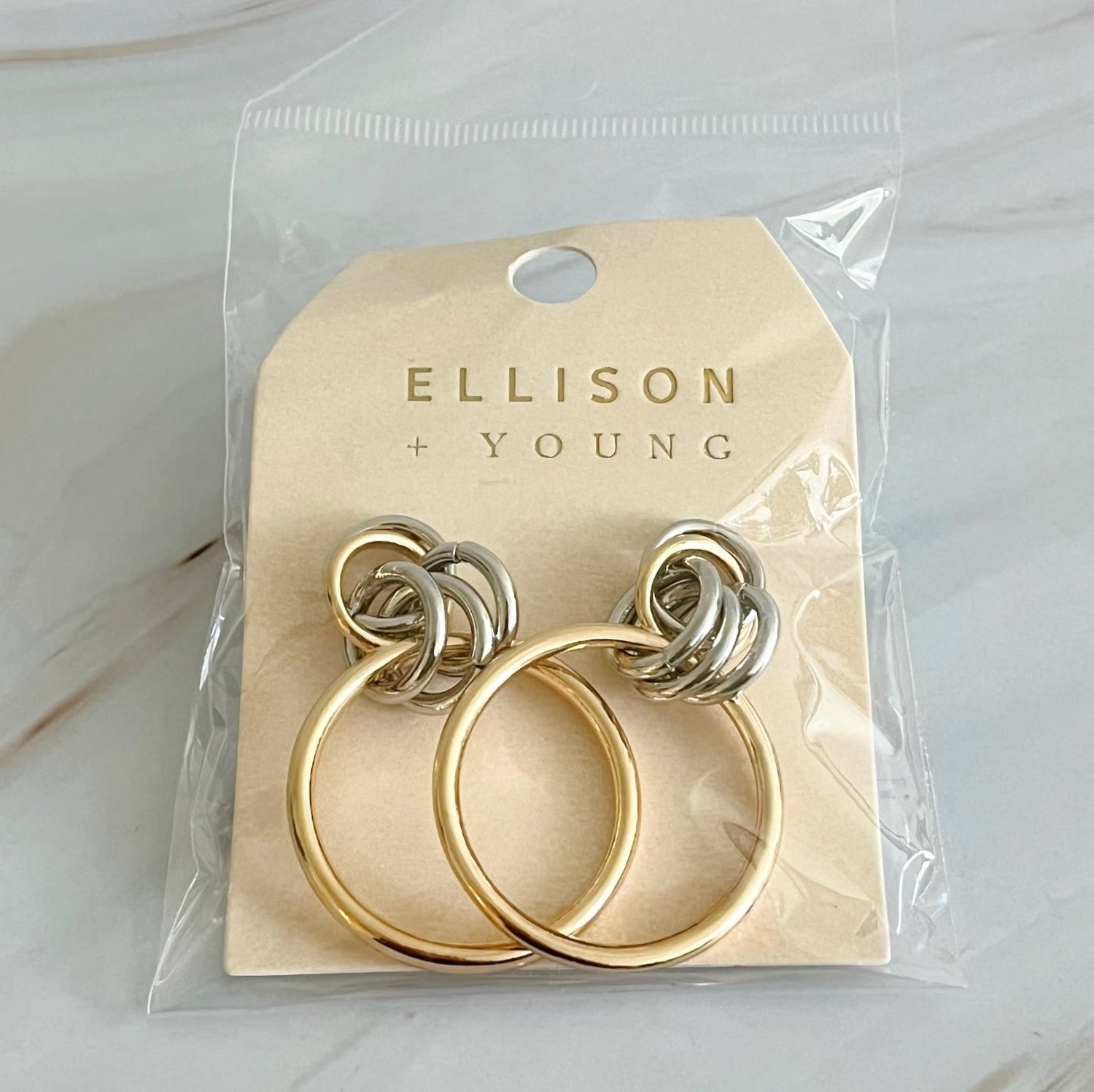 Fuchsia Hercules Knock On The Beauty hoop earrings in gold, featuring a sleek and stylish jewelry design.