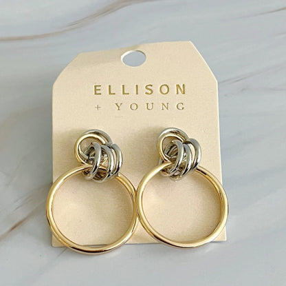 Fuchsia Hercules Knock On The Beauty hoop earrings, gold-tone jewelry with a sleek, modern design, shown on a white background.