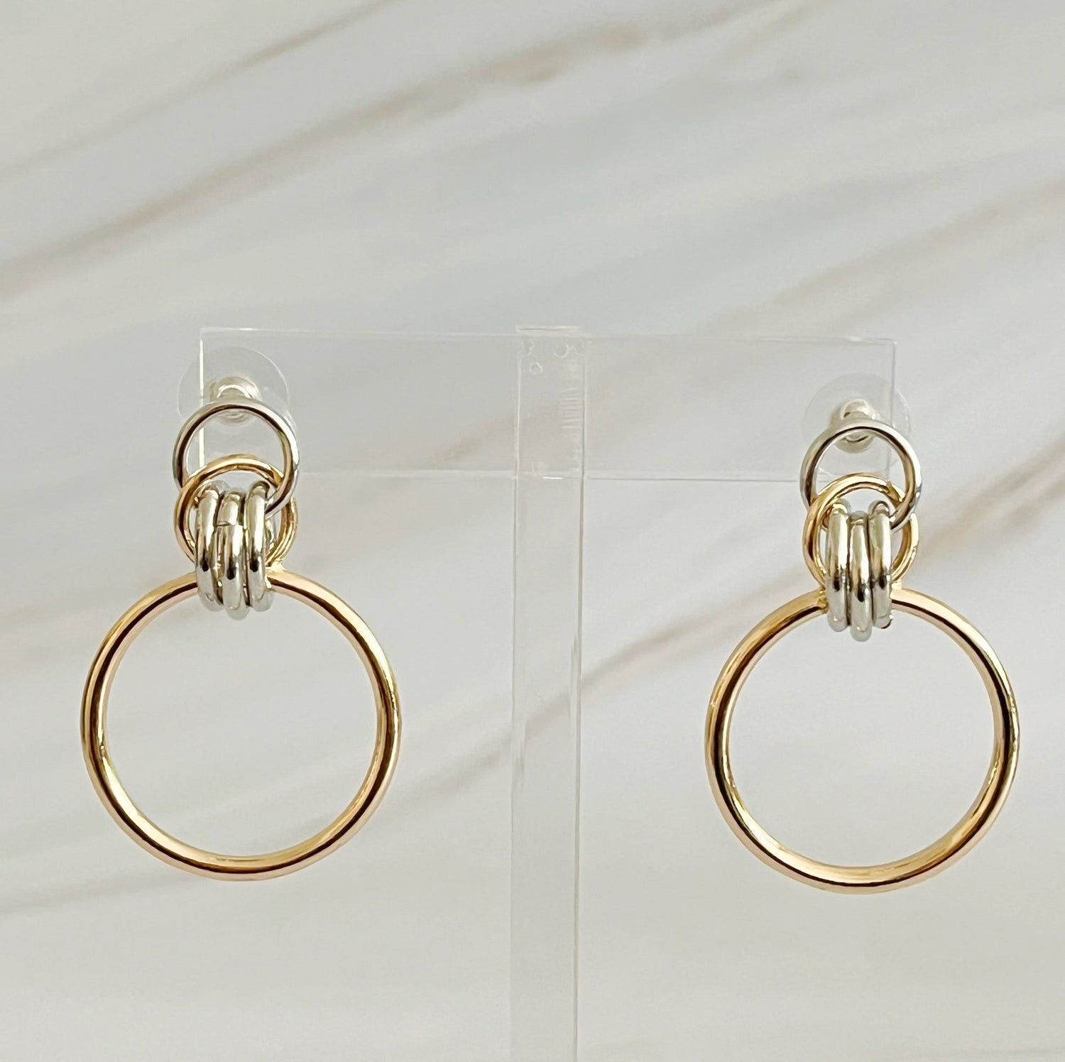Fuchsia Hercules Knock On The Beauty hoop earrings made of sterling silver with a polished finish, displayed on a white background.
