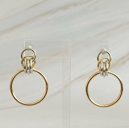 Fuchsia Hercules Knock On The Beauty hoop earrings made of sterling silver with a polished finish, displayed on a white background.