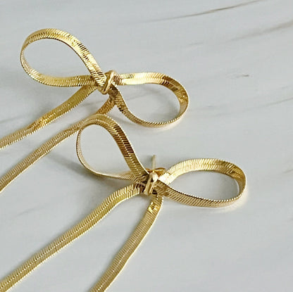 Fuchsia Hercules long drop bow earrings featuring elegant, dangling design in jewelry and watches category.