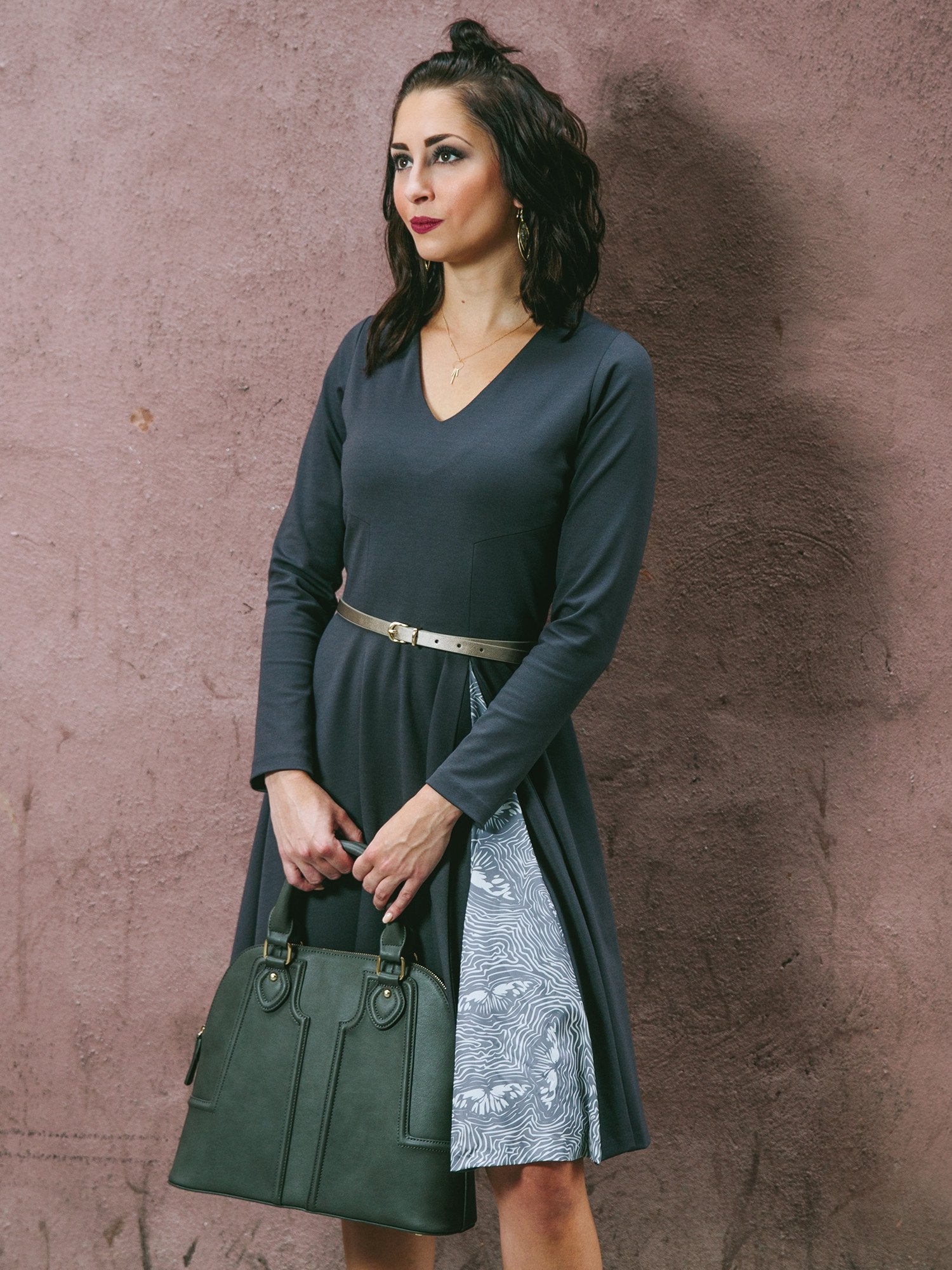 Salmon Bella swing dress with flowing fabric and short sleeves, displayed on a hanger against a neutral background.