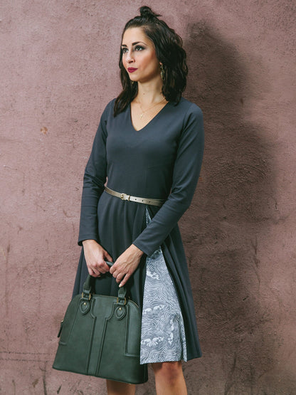 Salmon Bella swing dress with flowing fabric and short sleeves, displayed on a hanger against a neutral background.