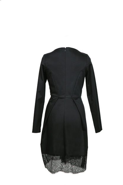 Salmon Bella First Lady dress shown from the back, elegant dress with flowing fabric and stylish design.