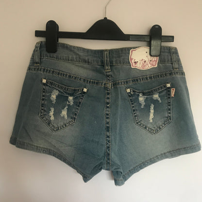 Flower rhinestones denim shorts by Blush Bella featuring decorative floral rhinestone embellishments on casual denim.