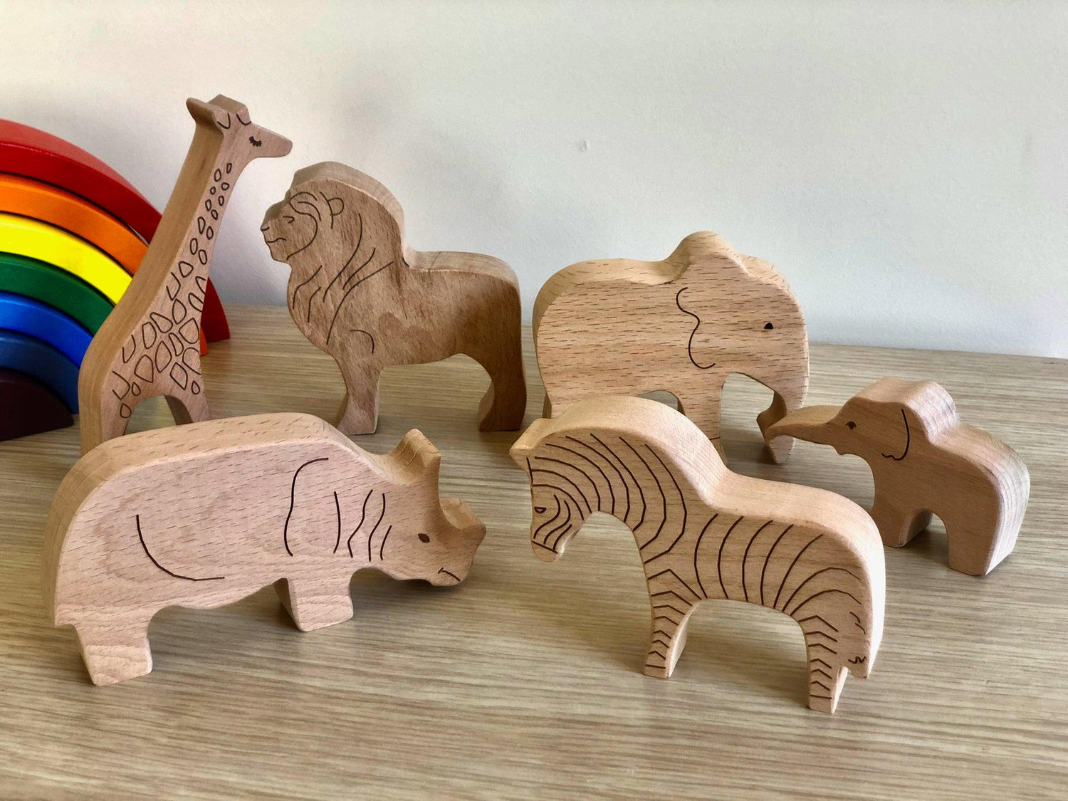 Set of wooden safari animal figures from Red Oceanus, designed as furniture decor for children&