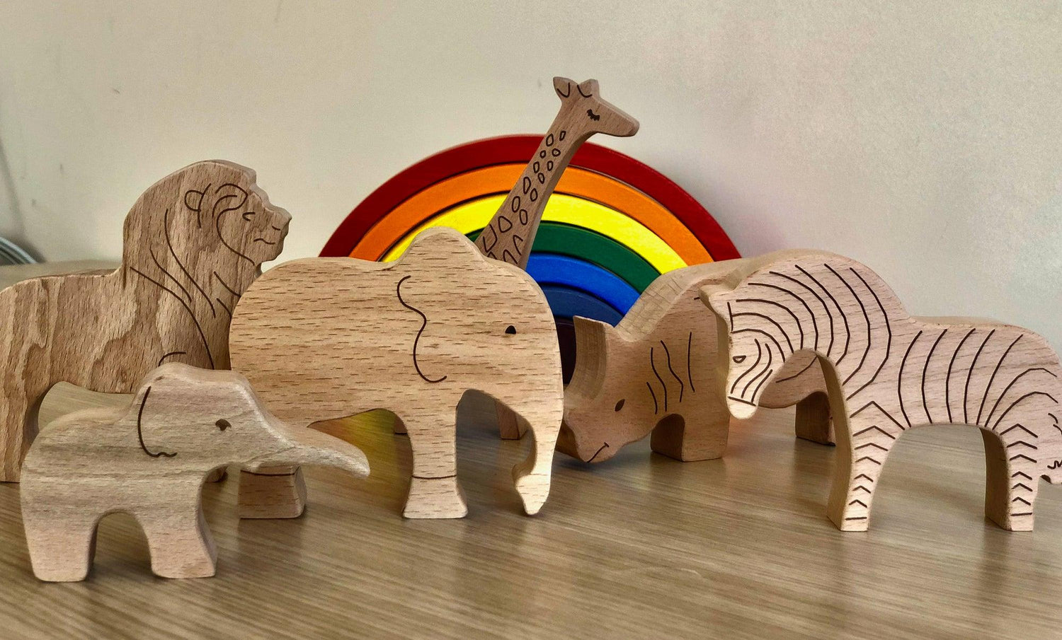 Wooden Safari Animals set by Red Oceanus, featuring handcrafted animal-shaped furniture pieces for children’s room decor.