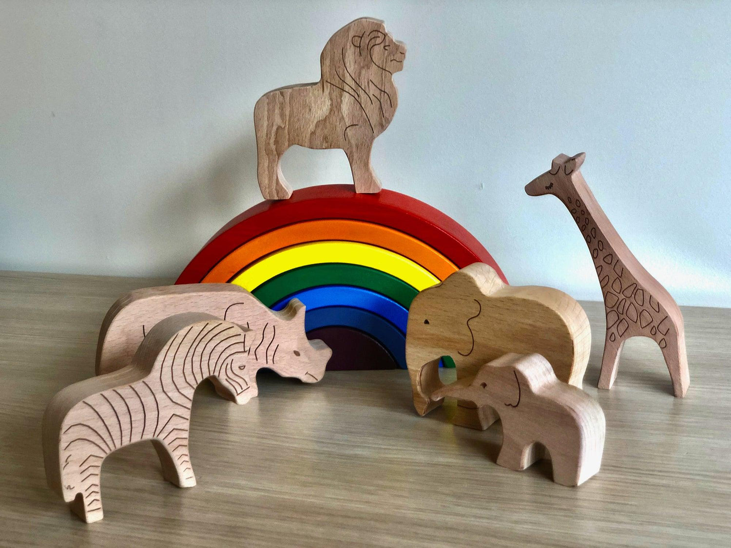 Wooden safari animal furniture set by Red Oceanus, featuring handcrafted wooden animal figures for children&