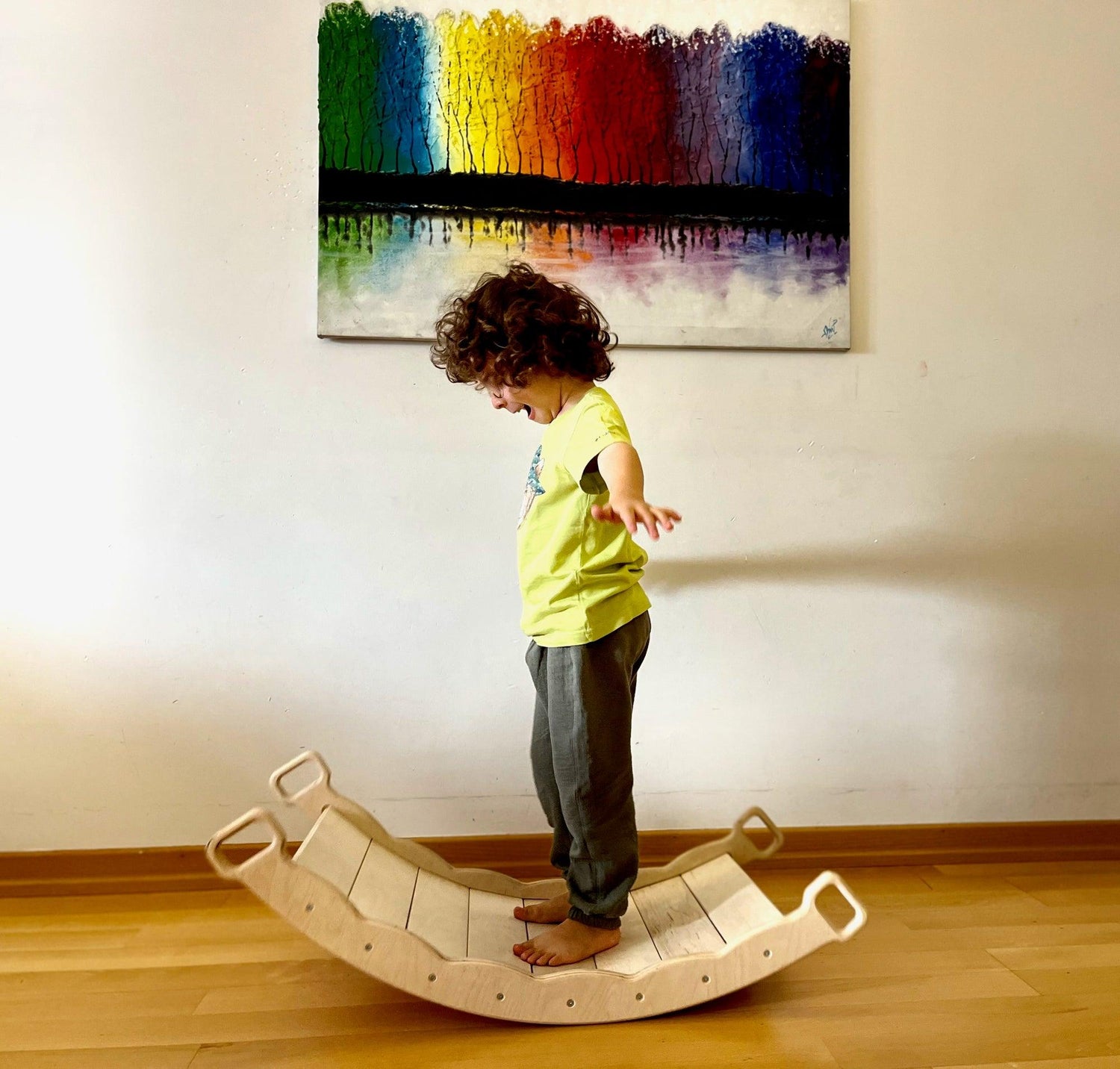 Red Oceanus XL wooden balance board with pillow, designed for furniture use, featuring a smooth wooden surface and comfortable pillow.