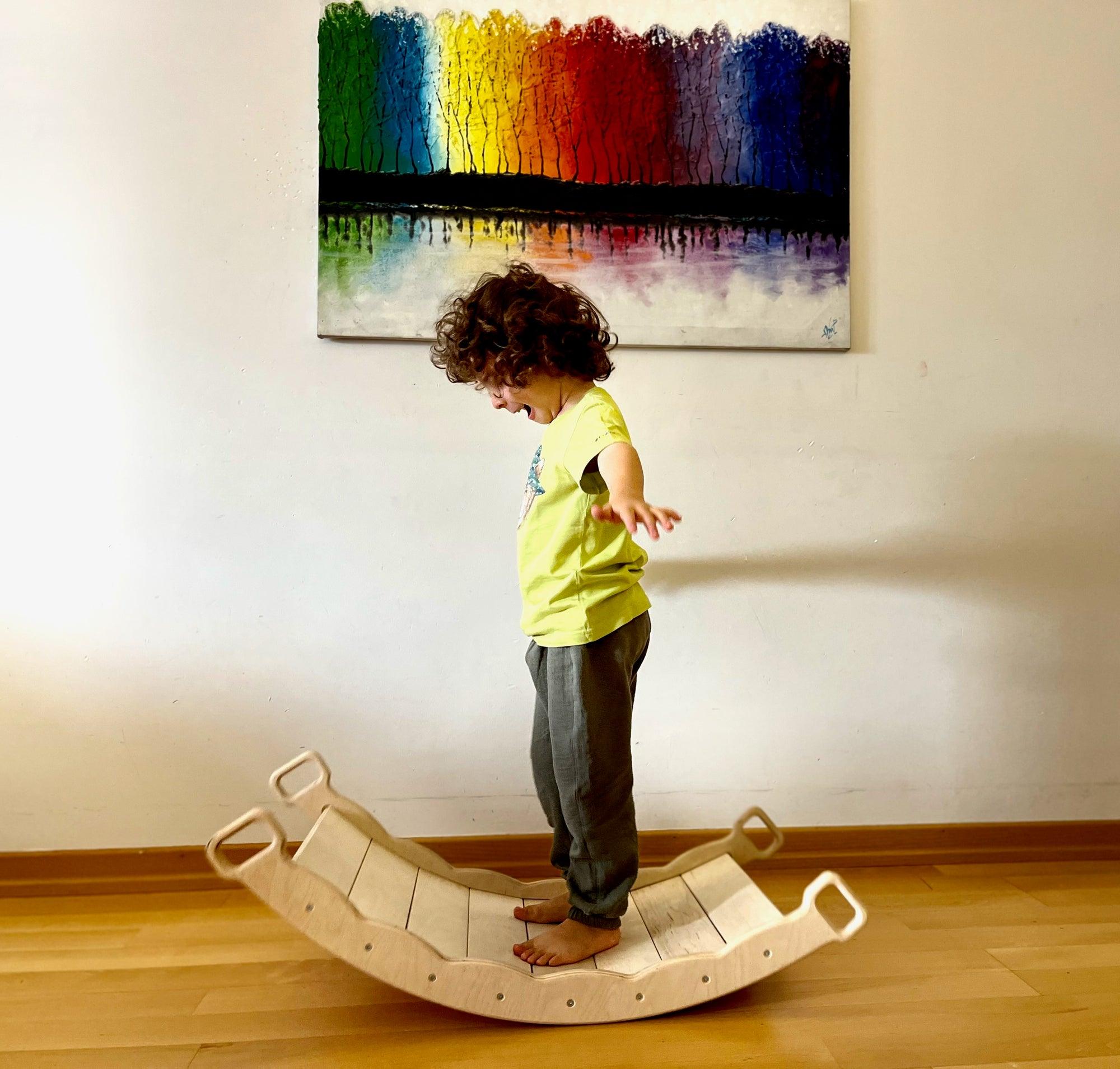 Red Oceanus XL wooden balance board with pillow, designed for furniture use, featuring a smooth wooden surface and comfortable pillow.