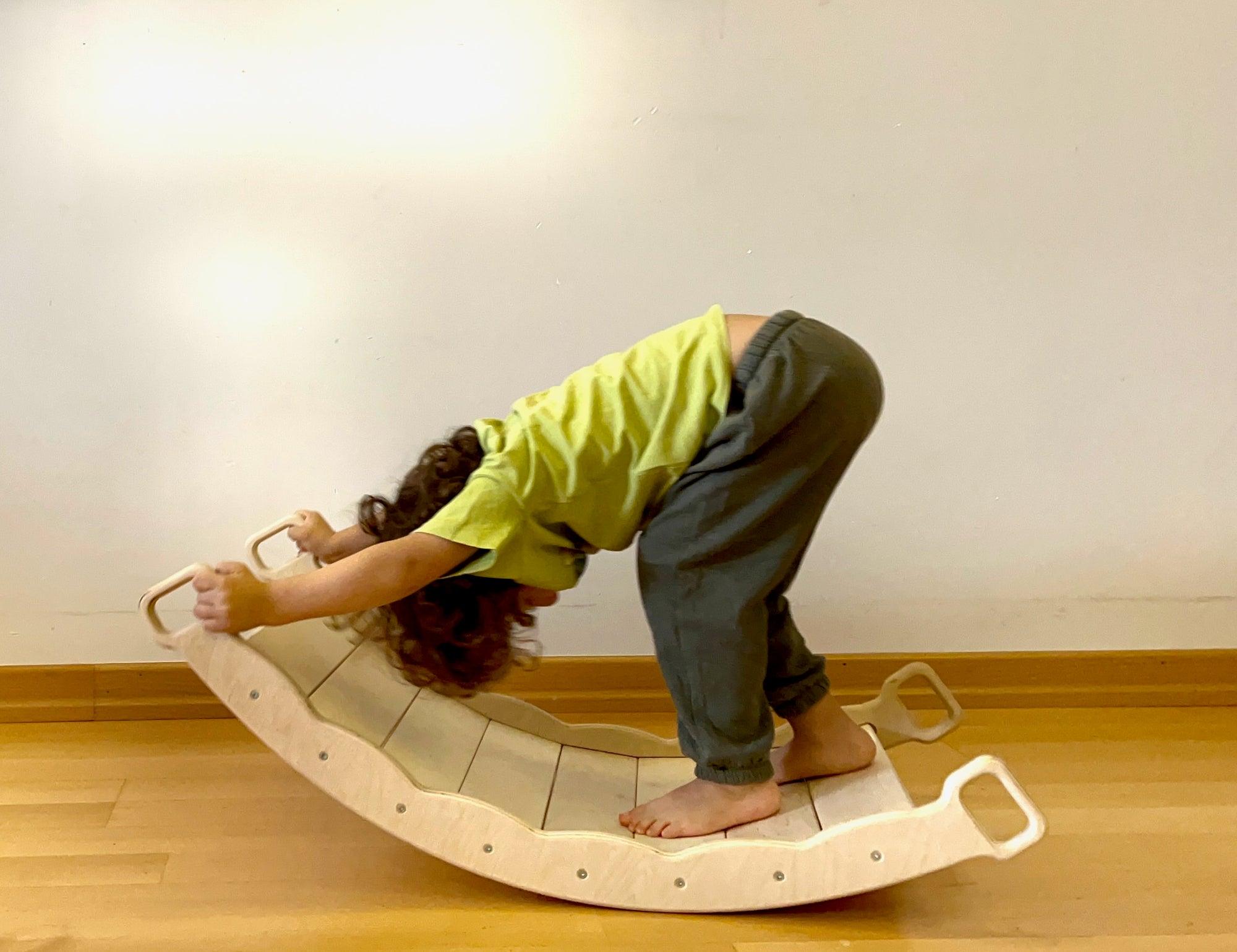 Red Oceanus XL wooden balance board with pillow, versatile furniture piece for stability and relaxation in indoor spaces.