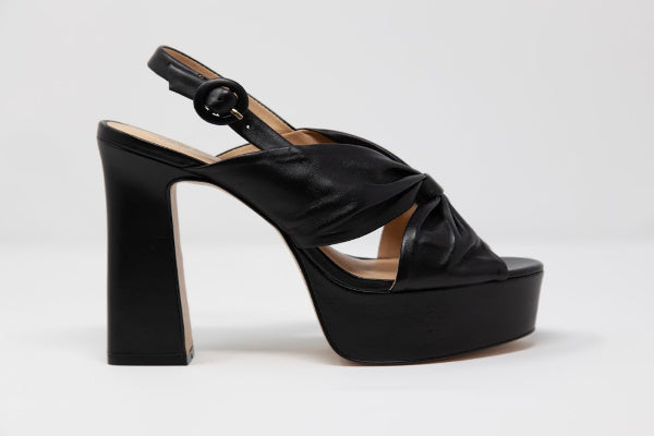 Apricot Hercules Stella Isidore heels with sleek design and pointed toe, shown in a stylish close-up image.