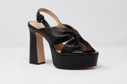 Apricot Hercules Stella Isidore heels featuring sleek design and pointed toes, shown on a neutral background.