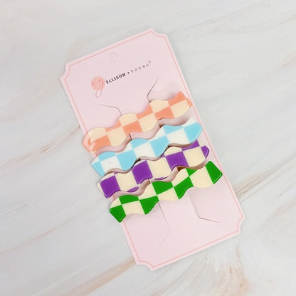 Set of four checkered wavy creaseless hair clips by Fuchsia Hercules, stylish jewelry accessories for hair styling.