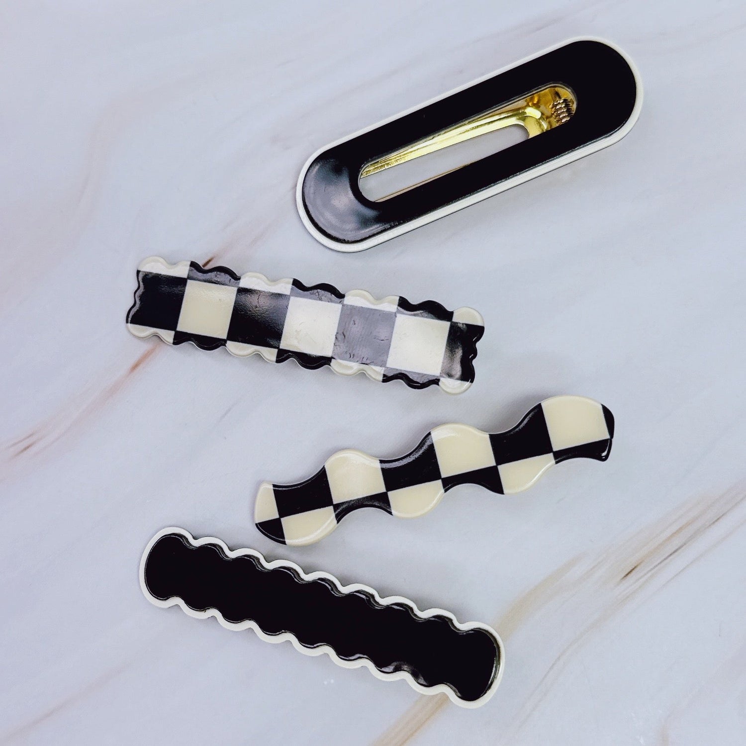 Set of four checkered wavy creaseless hair clips by Fuchsia Hercules, stylish jewelry accessories for hair styling.