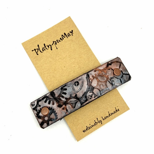 Copper and silver metallic gears steampunk stamped leather hair accessory by Orange Themis, suitable for stylish hair decor.