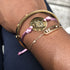 Black Girl Magic bracelet by Sky Blue Iapetus featuring a stylish black and gold design for home and garden decor.