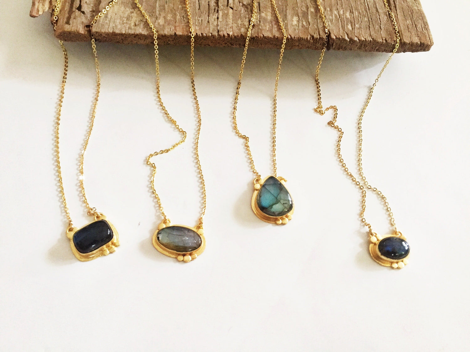 Agadir Labradorite pendant from Violet Baobab jewelry collection, showcasing a iridescent gemstone on a silver chain.