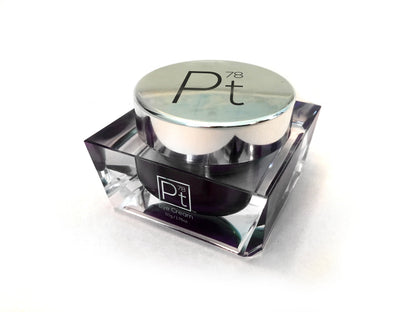 Amaranth Daisy Platinum Eye Cream in a sleek jar, designed for skincare and reducing puffiness around the eyes.