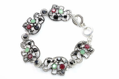 Silver Hestia Circle of Elephants bracelet featuring a silver bracelet with elephant charms on a white background.