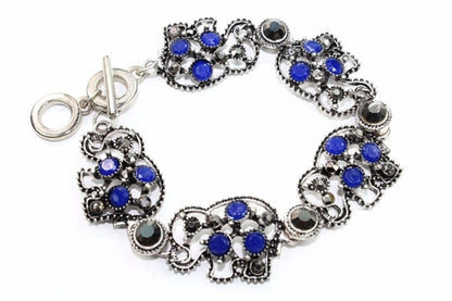 Silver Hestia Circle of Elephants bracelet featuring a silver bracelet with elephant charms on a white background.