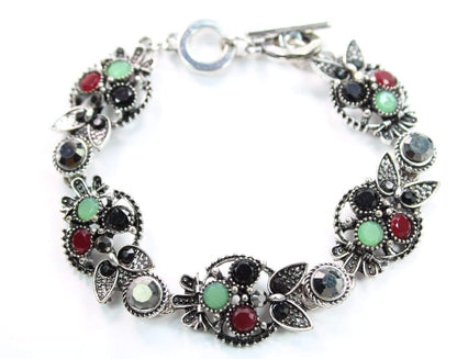 Silver Hestia Brilliant Multi Crystal Owl Bracelet featuring sparkling crystal owl charms on a silver chain.