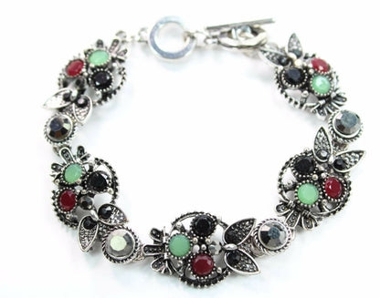 Silver Hestia Brilliant Multi Crystal Owl Bracelet featuring sparkling crystal owl charms on a silver chain.