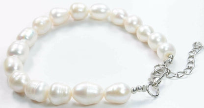 Silver Hestia lustrous oblong Baroque pearl bracelet featuring irregular-shaped pearls on a delicate silver chain.