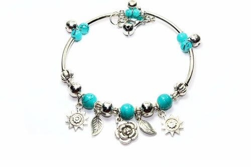 Silver Hestia Spring Love Charm Bracelet with delicate floral and heart charms on a silver chain.