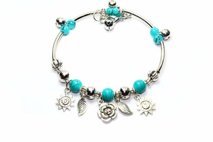 Silver Hestia Spring Love Charm Bracelet with delicate floral and heart charms on a silver chain.