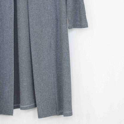 Yellow Hera long sleeve maxi cardigan draped over a hanger, showcasing its soft knit fabric and relaxed fit.