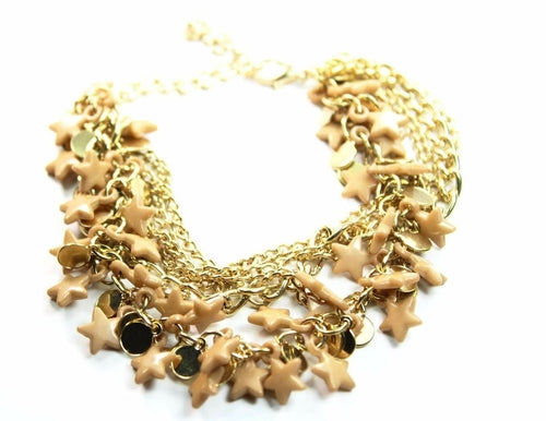 Silver Hestia three-tier star charm bracelet with layered silver chains and star pendants on a neutral background.
