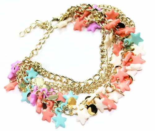 Silver Hestia three-tier star charm bracelet with layered silver chains and star-shaped charms on a neutral background.