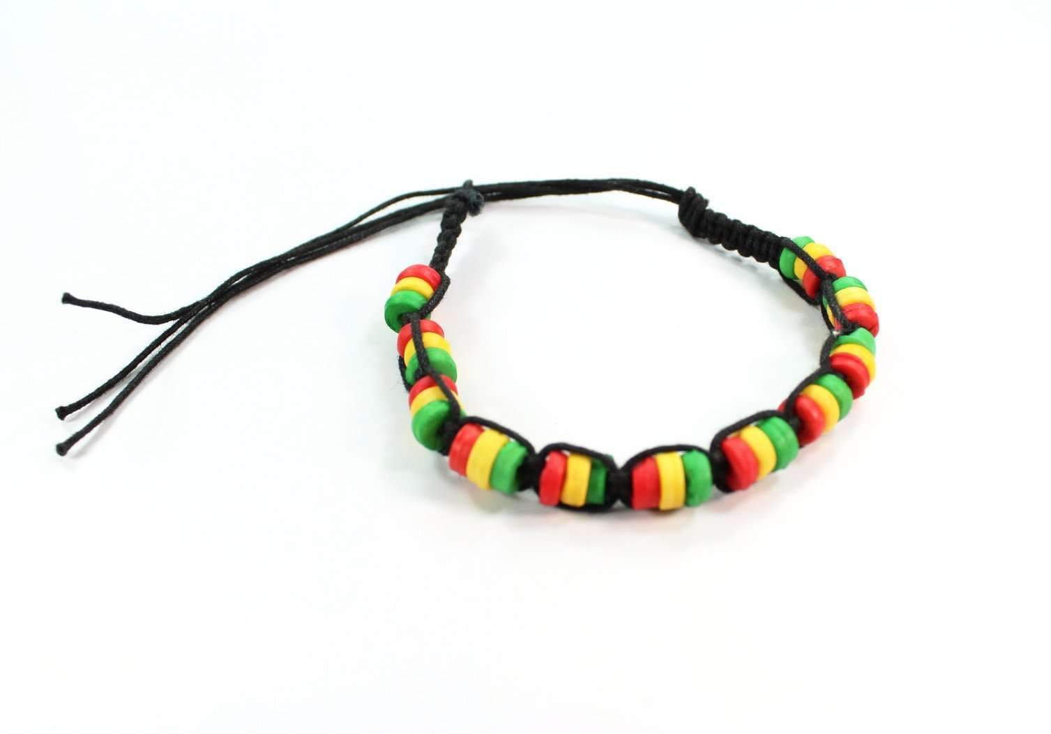 Colorful Rasta friendship bracelet by Silver Hestia with vibrant woven threads and adjustable closure on a plain background.