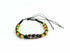 Silver Hestia friendship bracelet with chevron pattern and Rasta vibes featuring colorful thread and adjustable clasp.